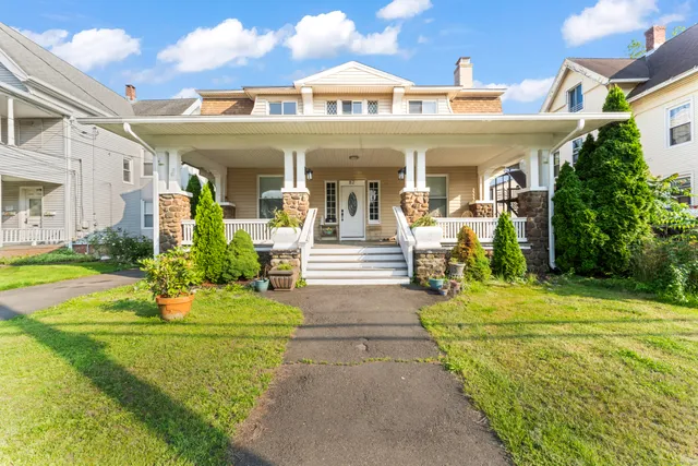 a front view of a house with swimming pool