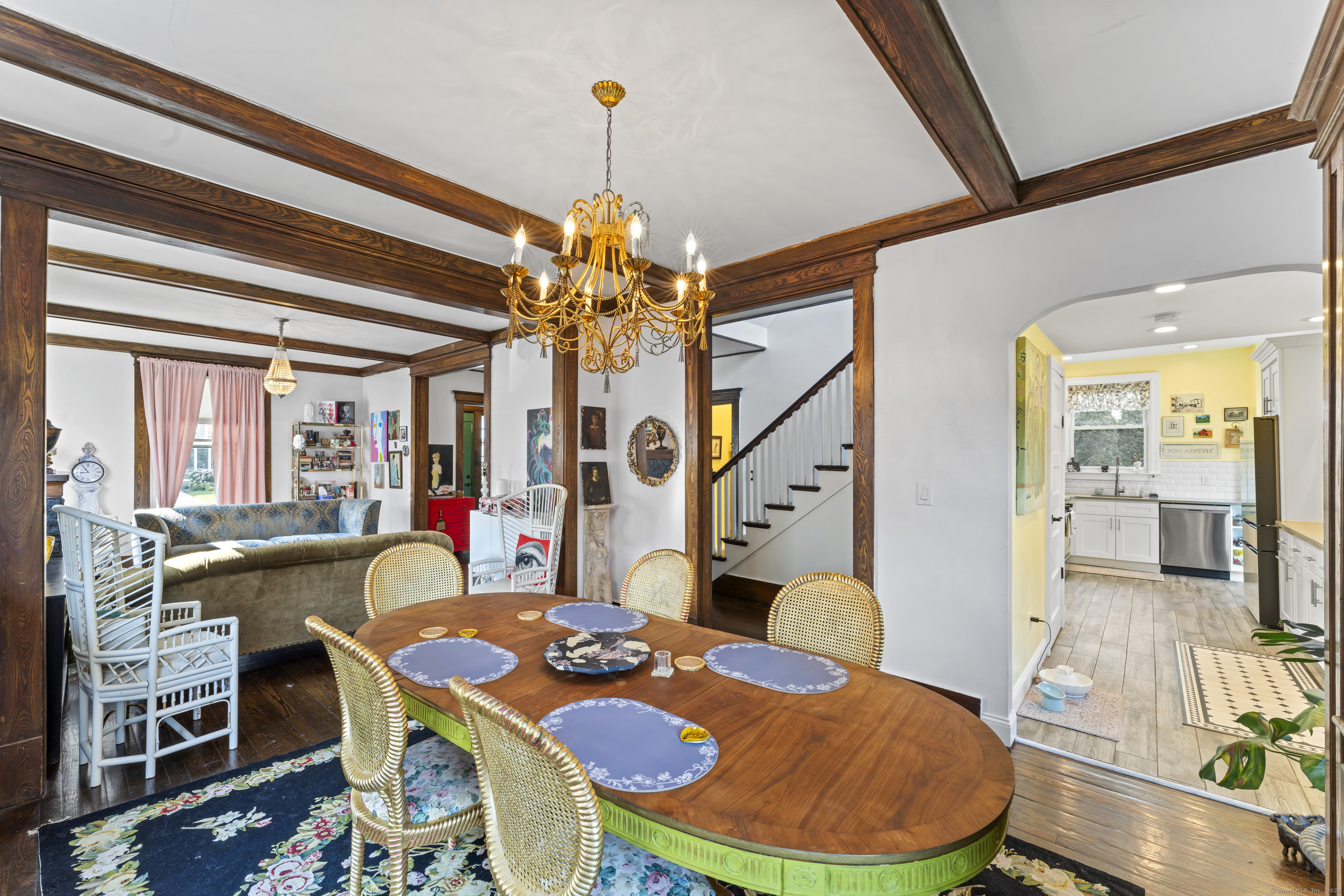 82 Main Street West Haven, CT 06516 - Photo 12 of 40 a dining room with furniture a chandelier and wooden floor