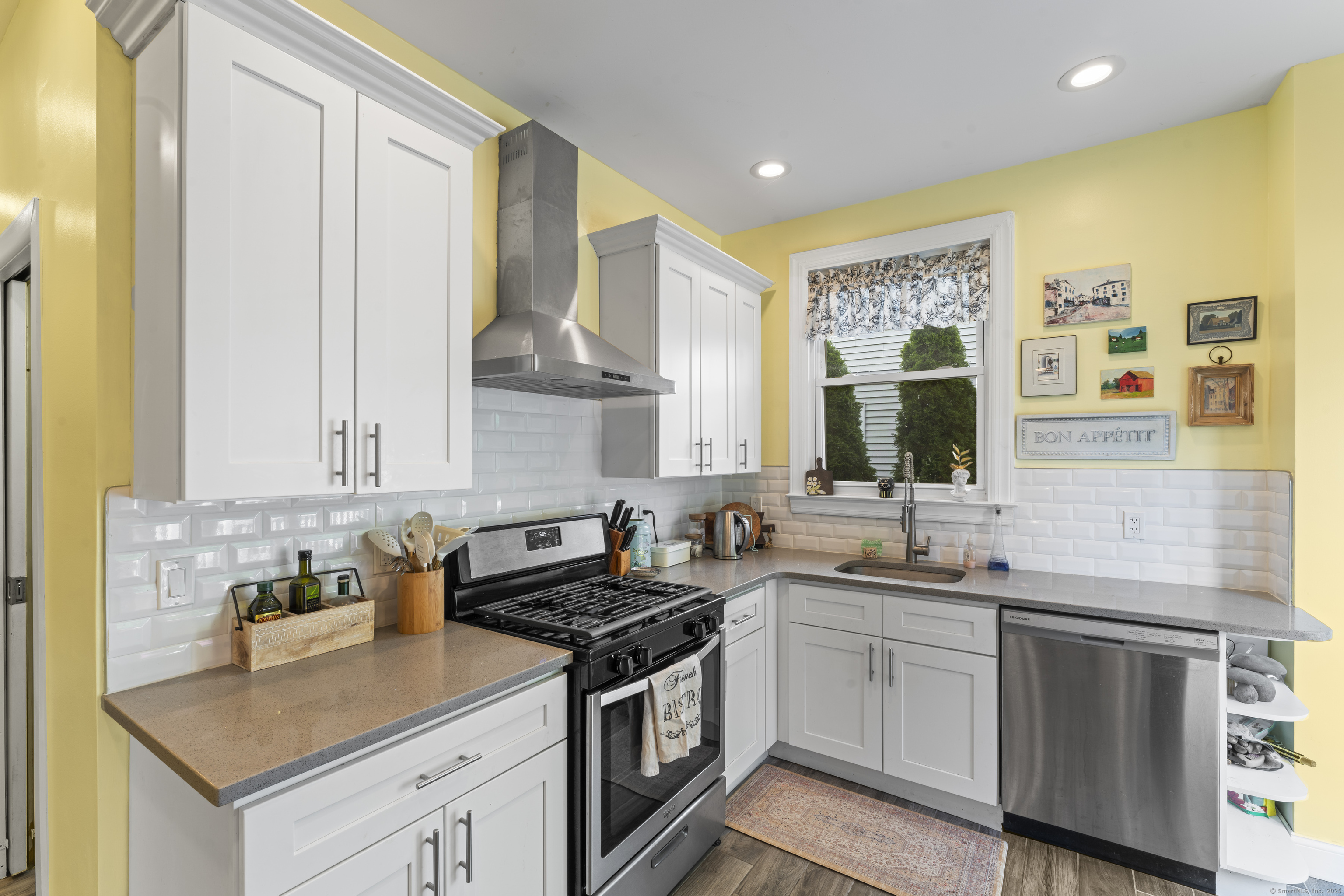 82 Main Street West Haven, CT 06516 - Photo 14 of 40 a kitchen with stainless steel appliances a sink stove and cabinets