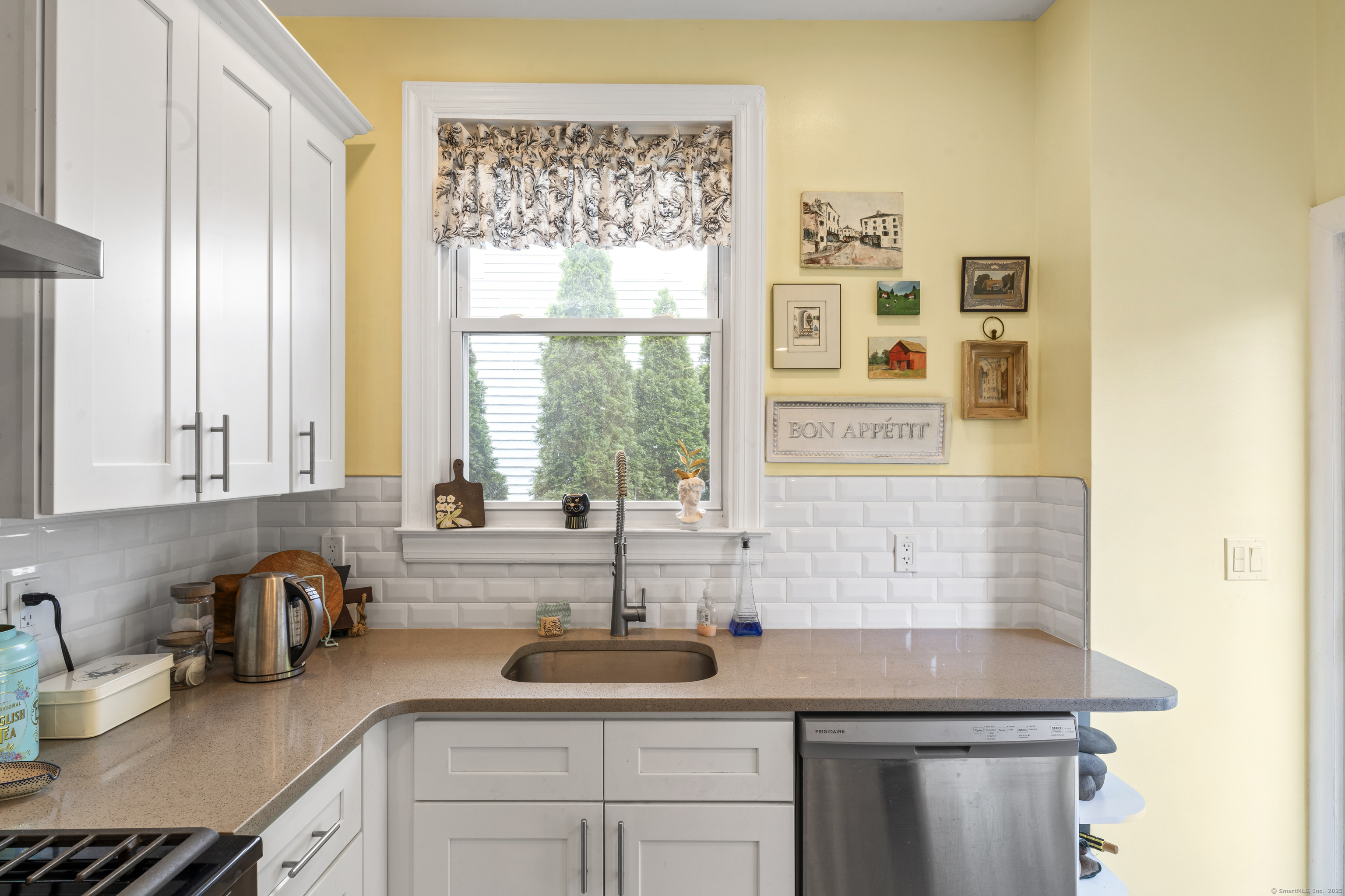 82 Main Street West Haven, CT 06516 - Photo 16 of 40 a kitchen with stainless steel appliances a sink a window and cabinets