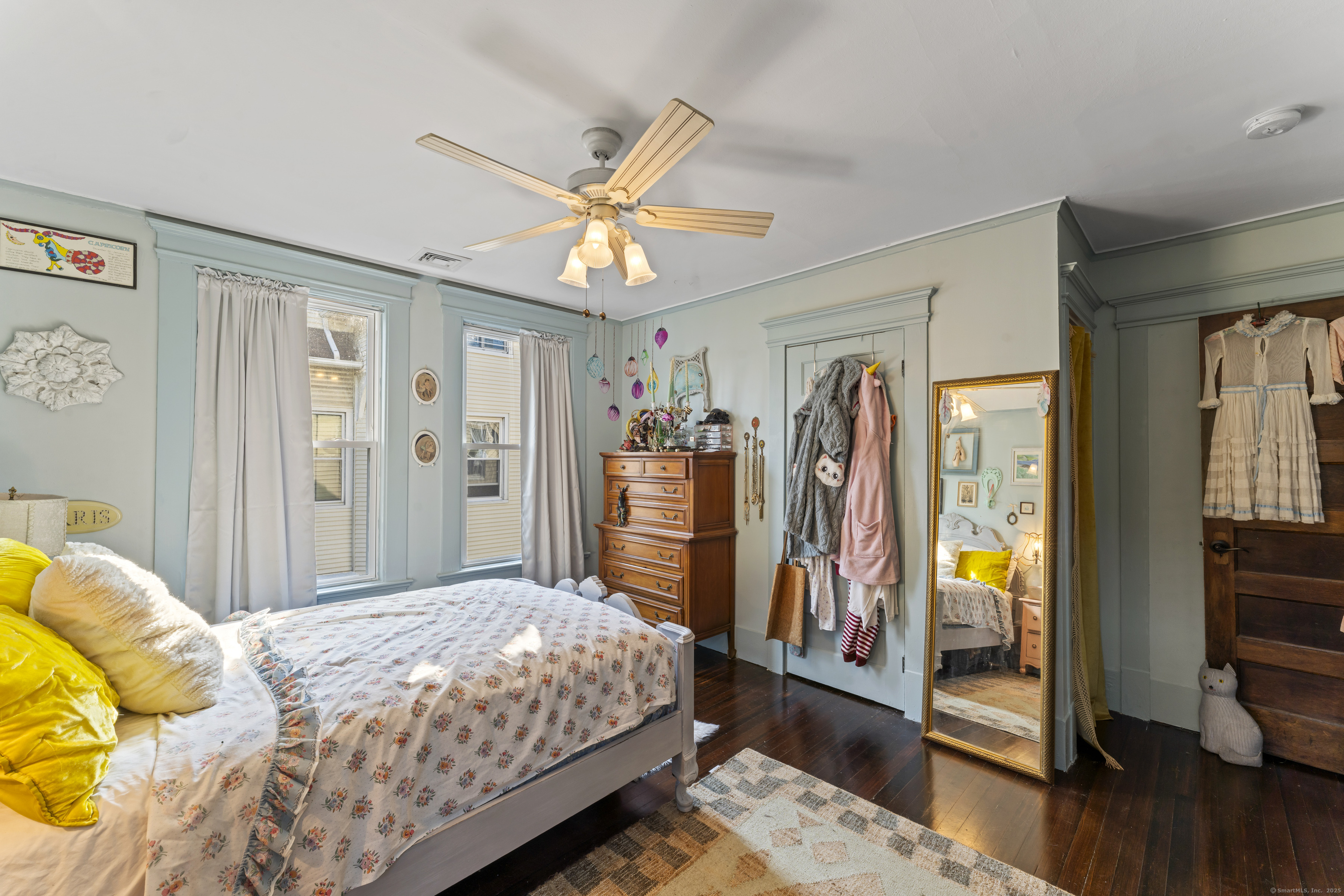 82 Main Street West Haven, CT 06516 - Photo 23 of 40 a bedroom with a bed and a flat tv screen on dresser