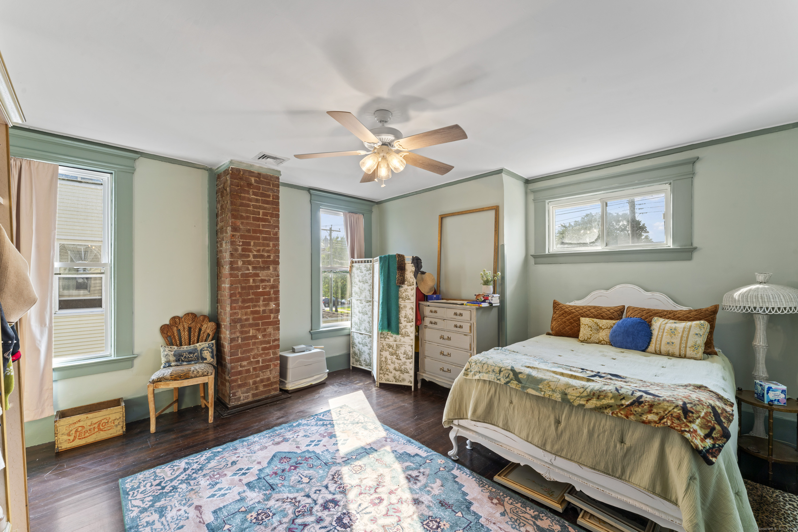 82 Main Street West Haven, CT 06516 - Photo 24 of 40 a bedroom with a bed and a chandelier