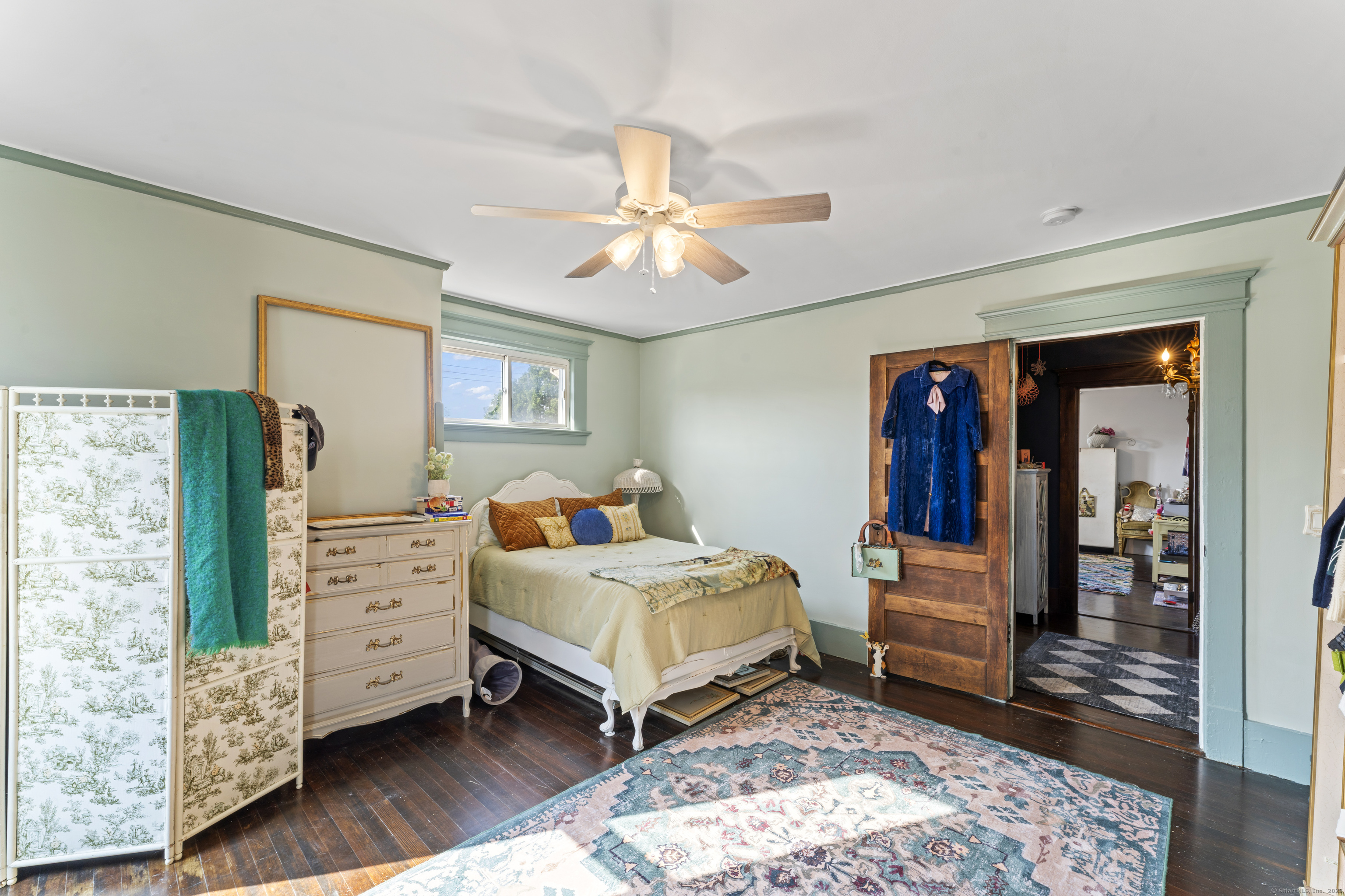 82 Main Street West Haven, CT 06516 - Photo 26 of 40 a bedroom with furniture and a baby crib