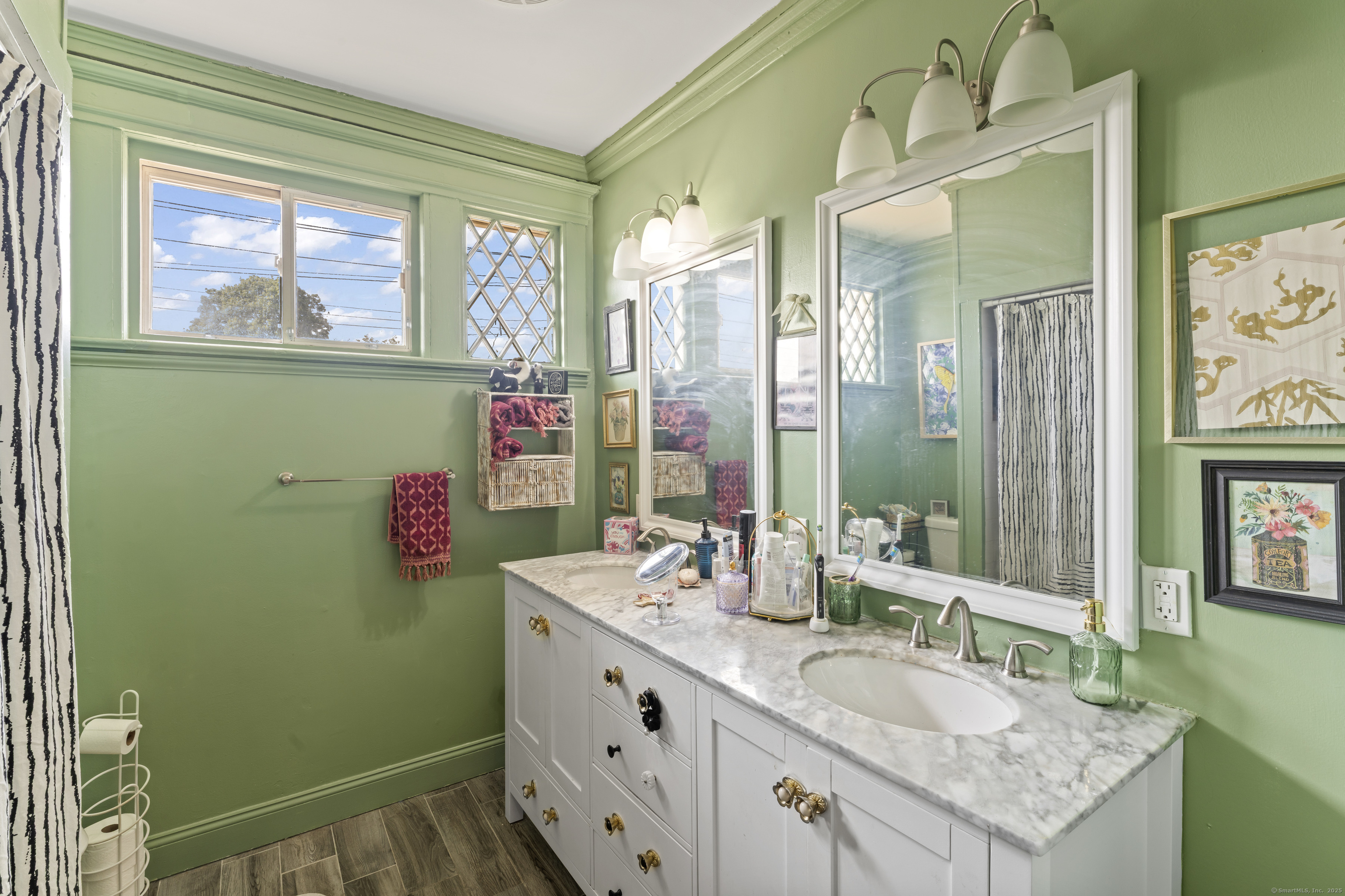 82 Main Street West Haven, CT 06516 - Photo 27 of 40 a bathroom with a granite countertop sink a mirror and a bathtub