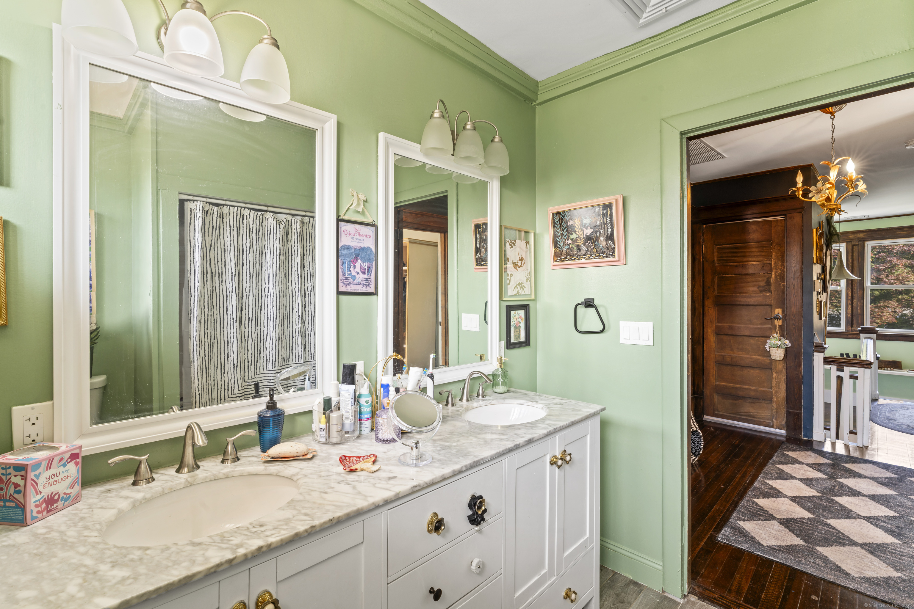 82 Main Street West Haven, CT 06516 - Photo 28 of 40 a bathroom with a granite countertop double vanity sink a mirror and a shower
