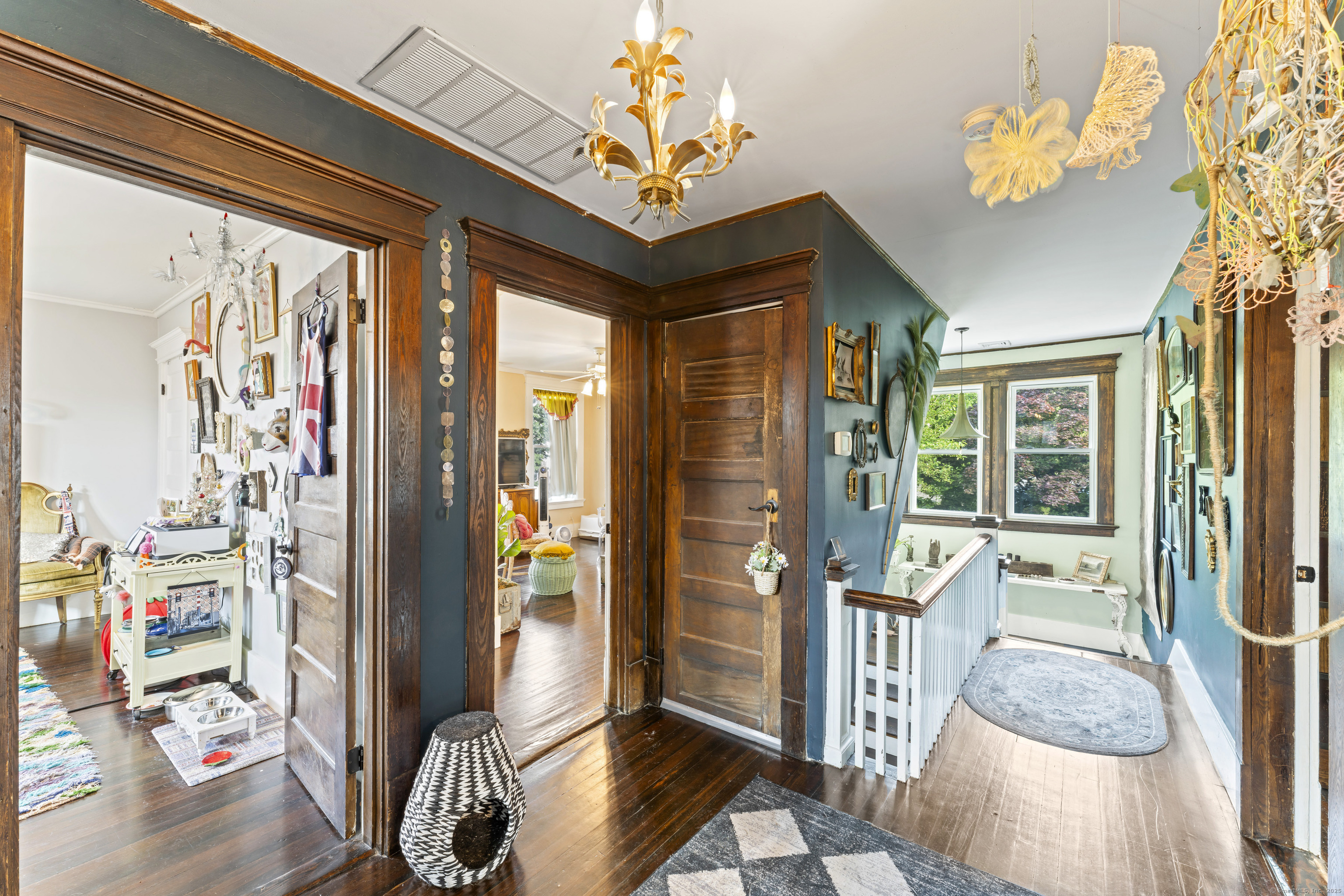 82 Main Street West Haven, CT 06516 - Photo 29 of 40 a view of an entryway with wooden floor and a chandelier