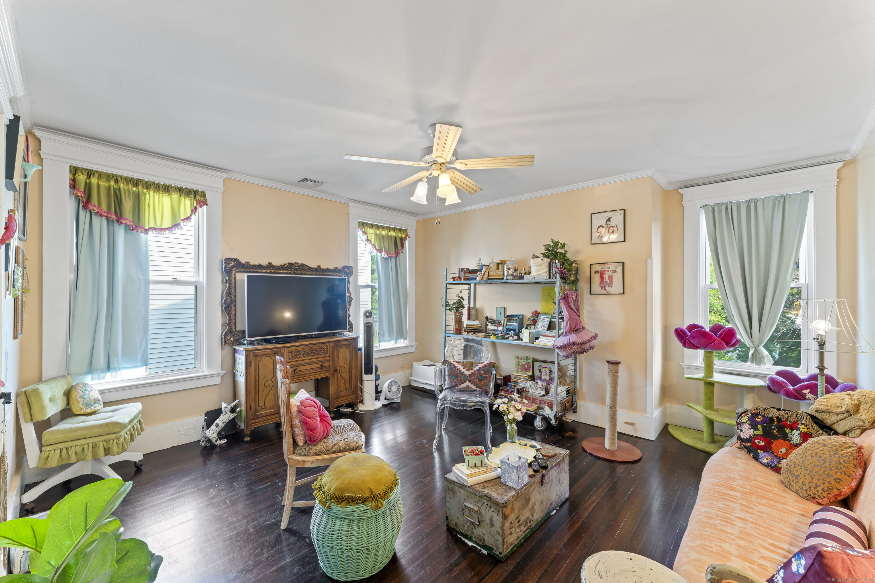 82 Main Street West Haven, CT 06516 - Photo 30 of 40 a living room with furniture and a flat screen tv