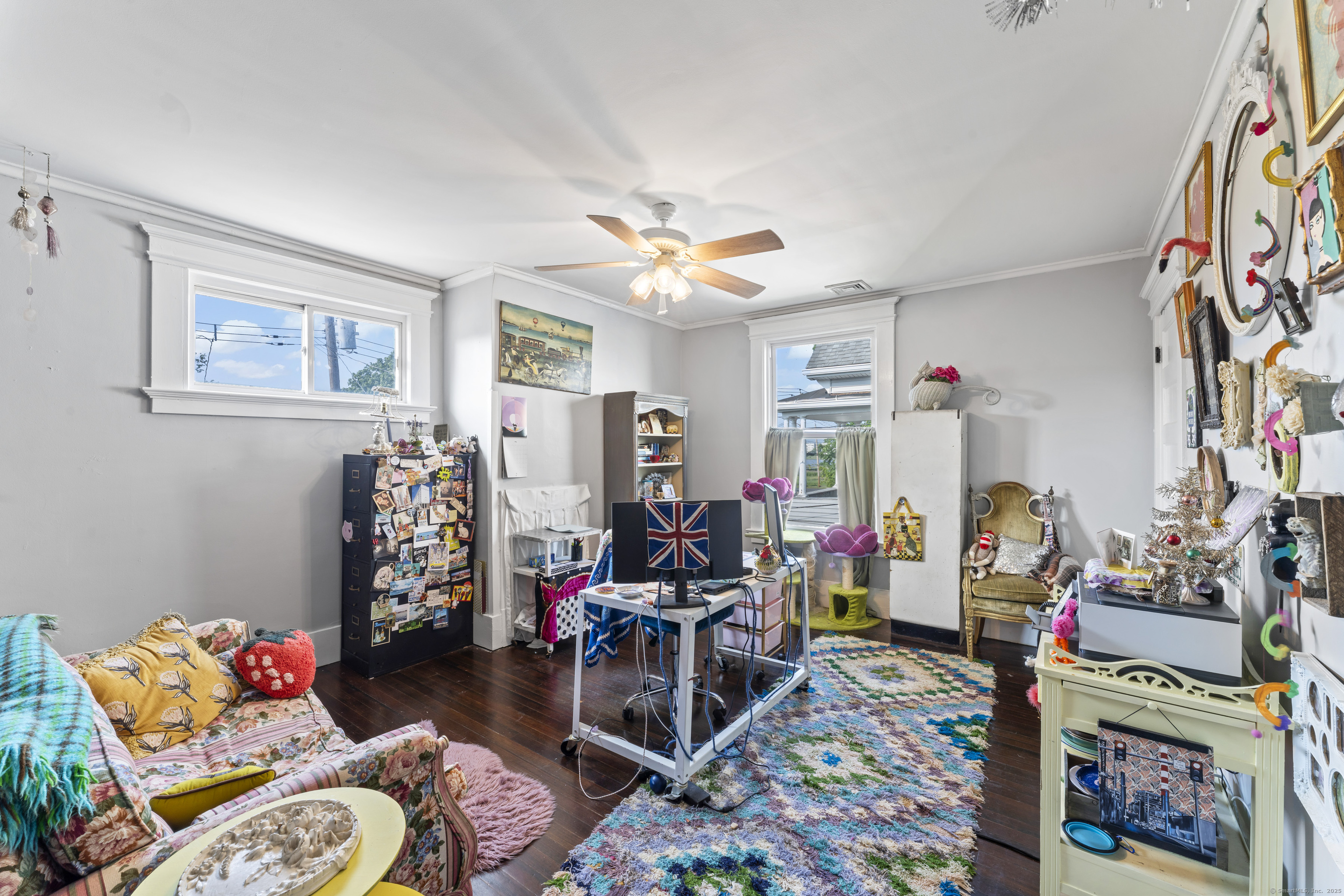 82 Main Street West Haven, CT 06516 - Photo 32 of 40 a living room filled with furniture and a chandelier