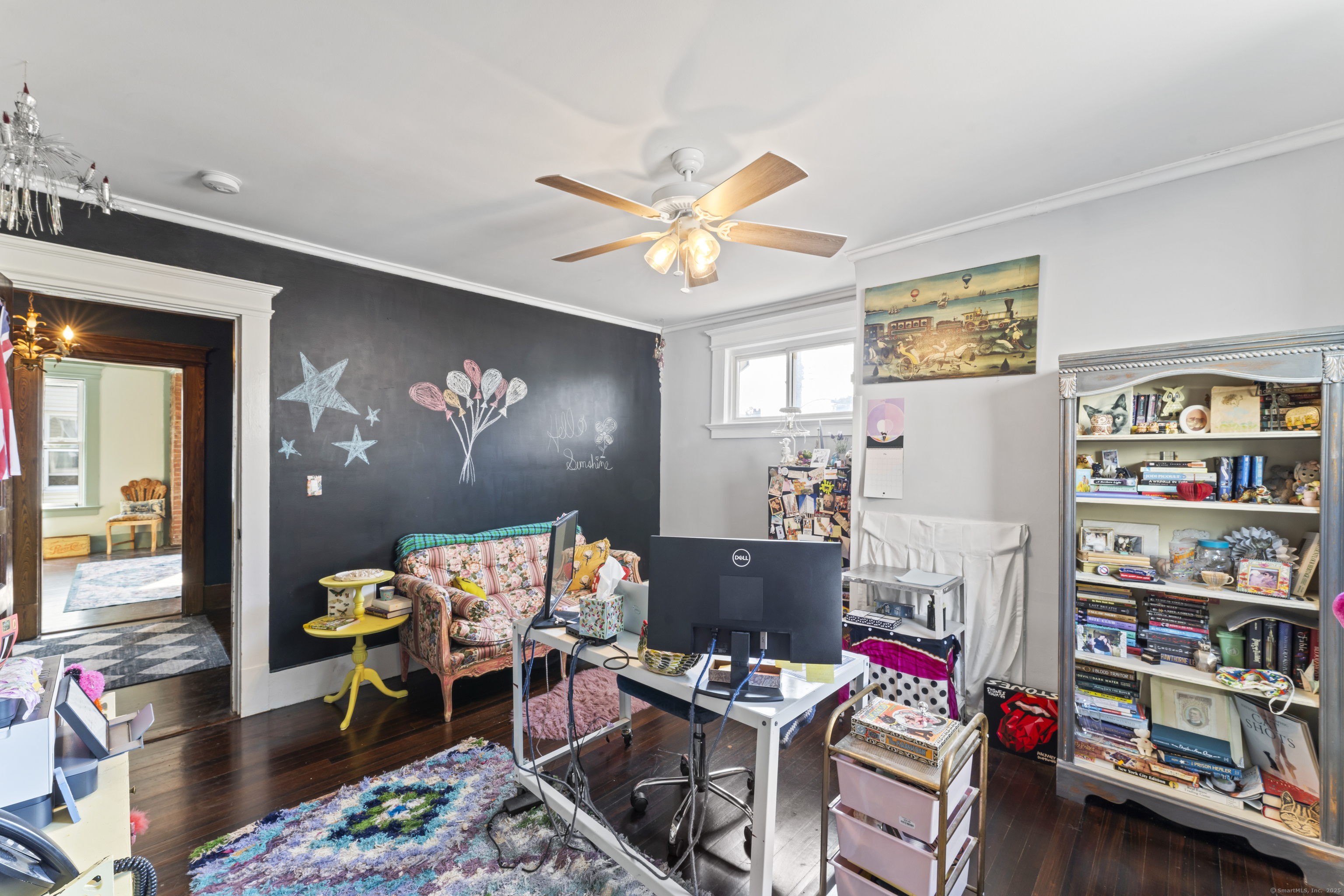 82 Main Street West Haven, CT 06516 - Photo 33 of 40 a living room with furniture a rug and a bookshelf