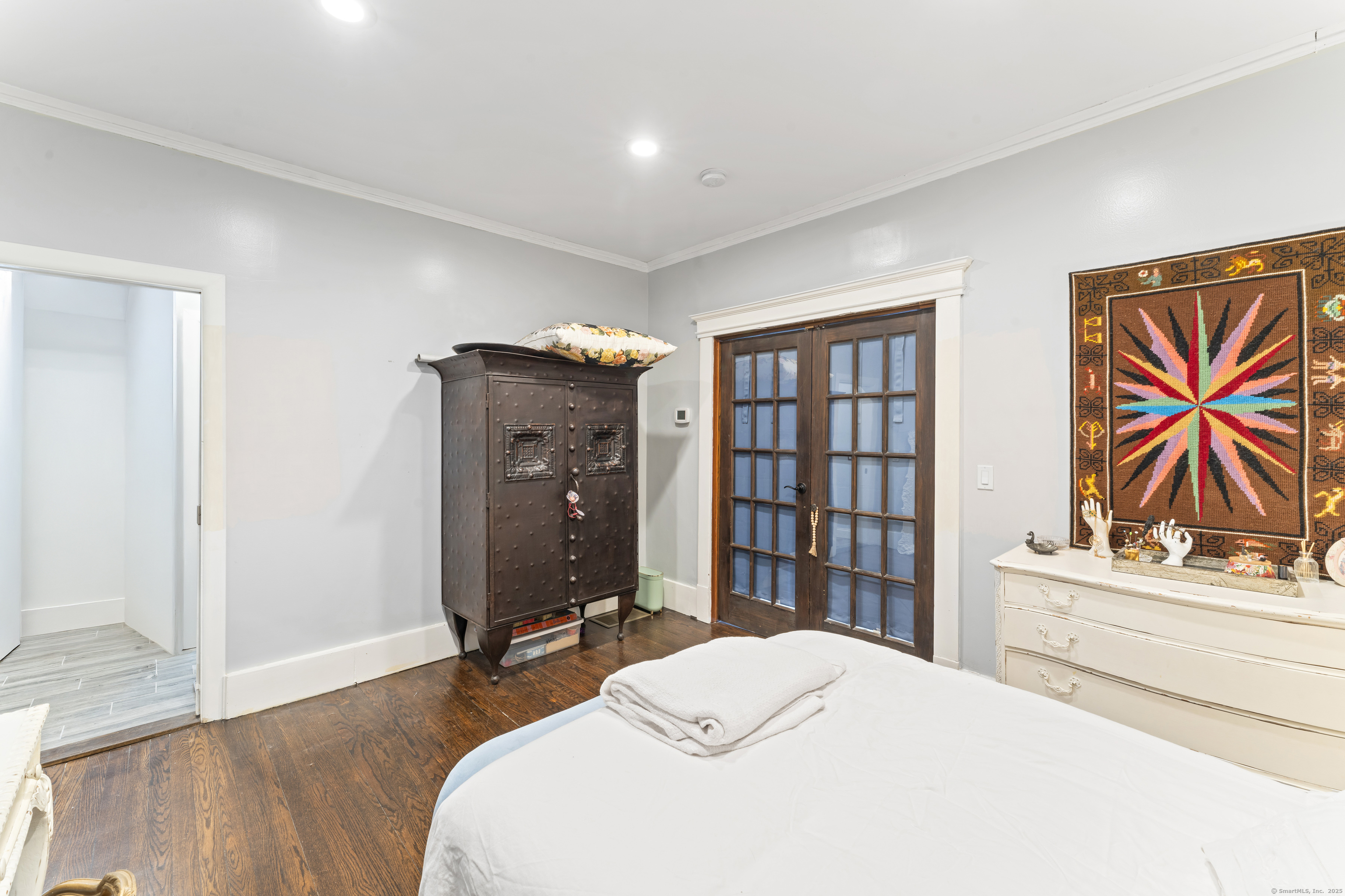 82 Main Street West Haven, CT 06516 - Photo 36 of 40 a bedroom with a bed and a flat screen tv