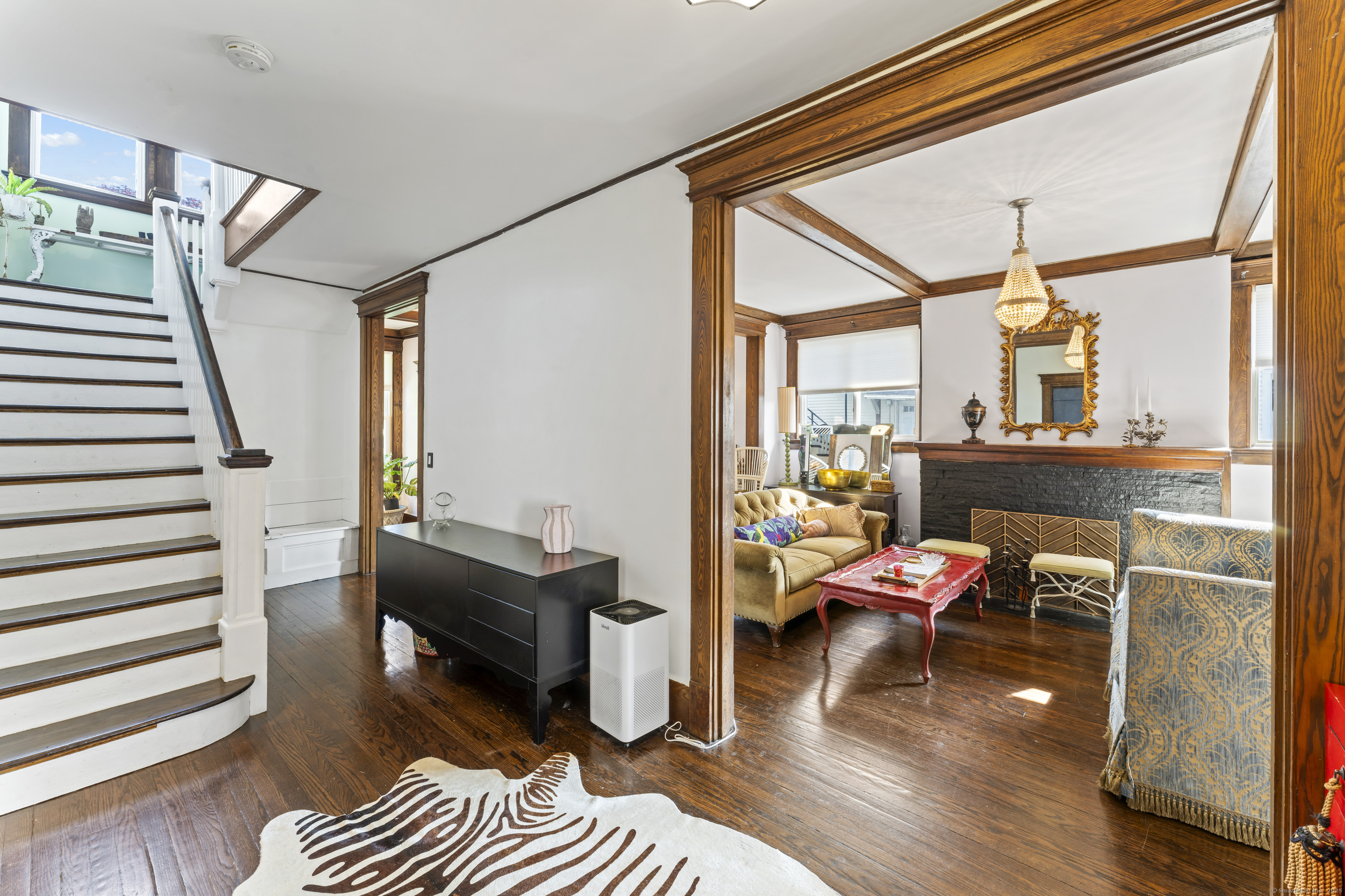 82 Main Street West Haven, CT 06516 - Photo 8 of 40 a living room with furniture and a window