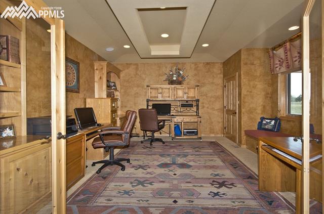 5320 Roundup Ridge Road Colorado Springs, CO 80908 - Photo 4 of 18 Office with closet, window bench, built in cabinets and shelves.