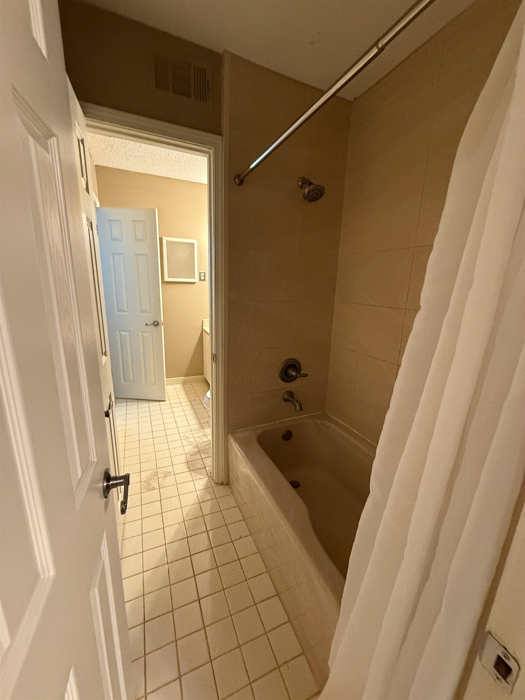 5718 Quince Road, Unit 1 Memphis, TN 38119 - Photo 12 of 17 a bathroom with a tub a sink and a shower