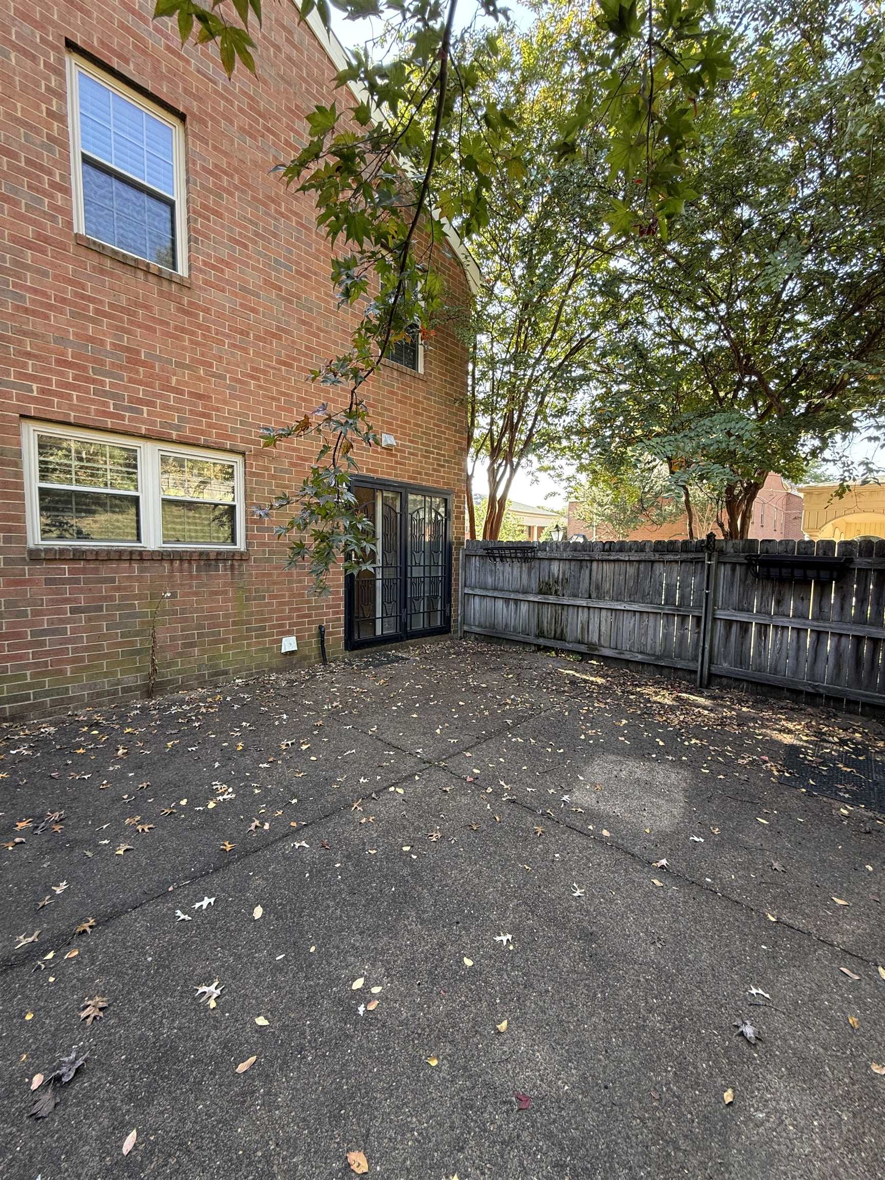 5718 Quince Road, Unit 1 Memphis, TN 38119 - Photo 16 of 17 a front view of a house with a tree