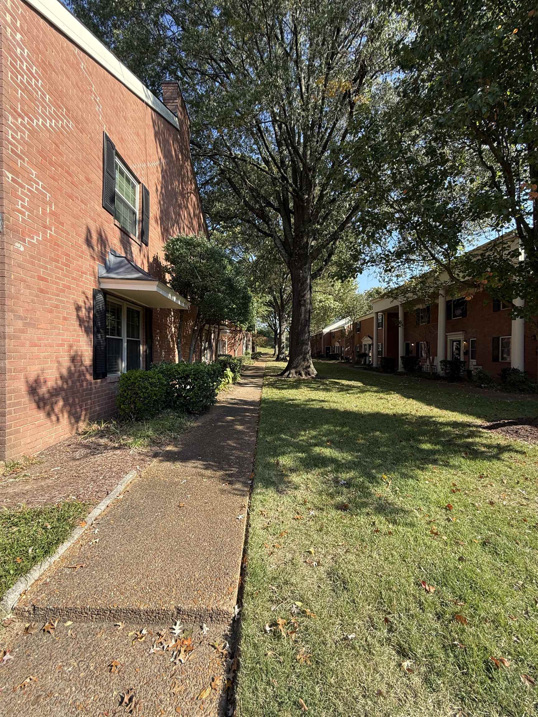 5718 Quince Road, Unit 1 Memphis, TN 38119 - Photo 5 of 17 a view of a house with a yard