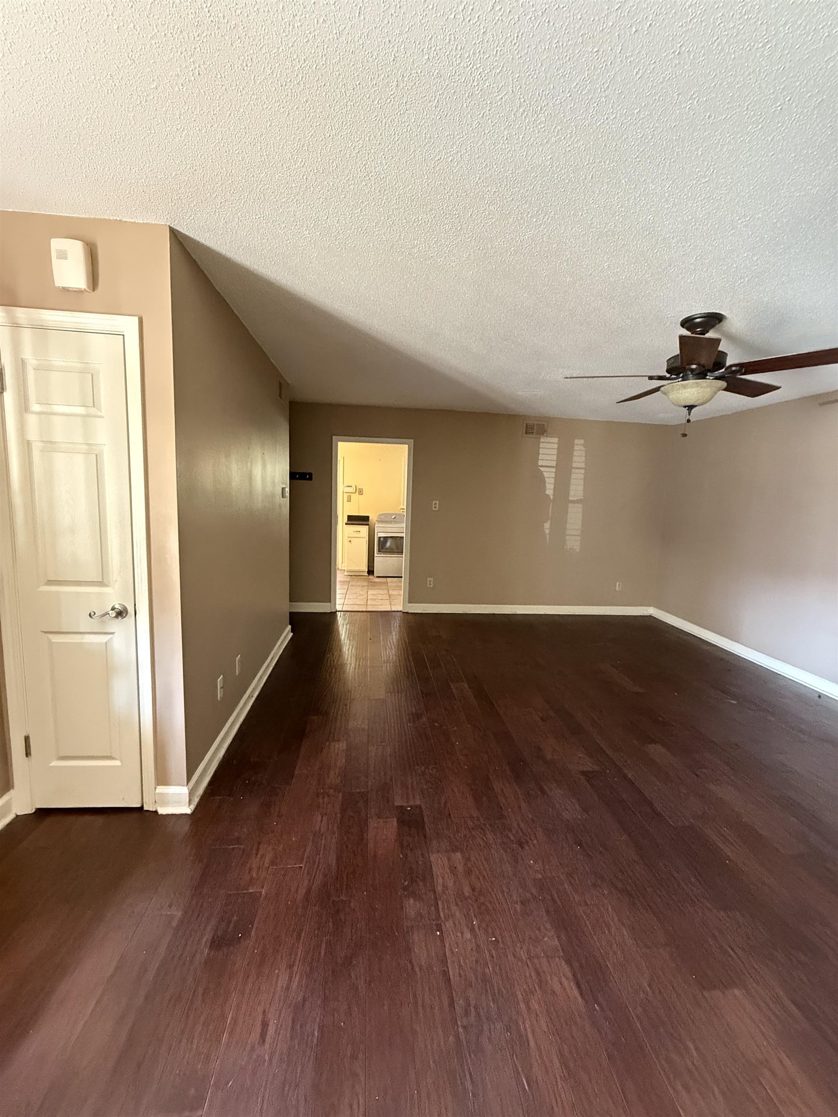 5718 Quince Road, Unit 1 Memphis, TN 38119 - Photo 7 of 17 an empty room with wooden floor and windows