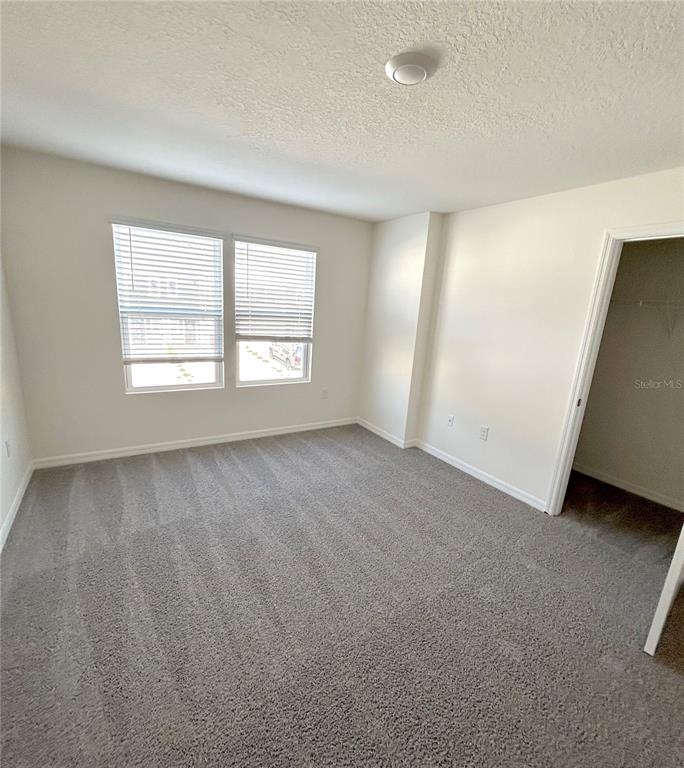 6582 South W 81st Loop Ocala, FL 34476 - Photo 4 of 12 a view of an empty room with a window