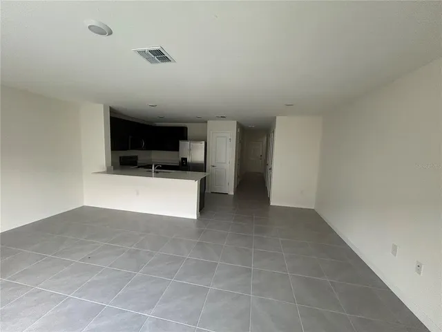 a view of a kitchen with a sink and a stove top oven