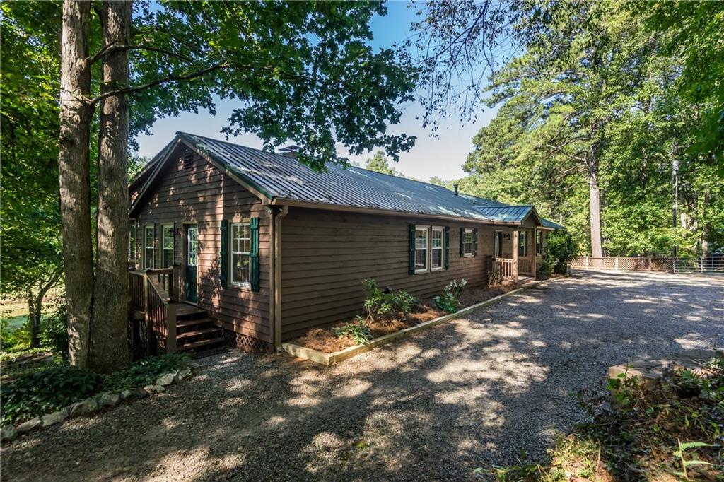 1938 Holcomb Road Dawsonville, GA 30534 - Photo 1 of 1 Located at the end of a very long driveway, the entrance is private and shaped.