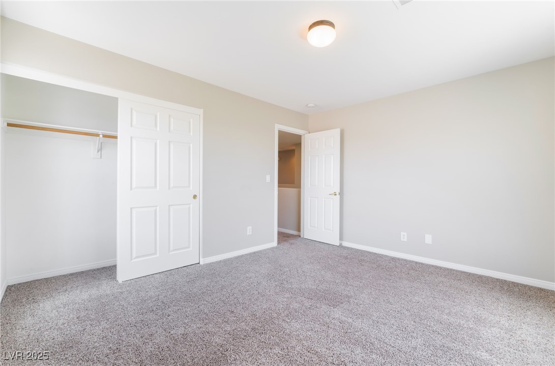 7857 Midnight Ride Street Las Vegas, NV 89131 - Photo 31 of 53 Unfurnished bedroom with carpet floors, baseboards, and a closet