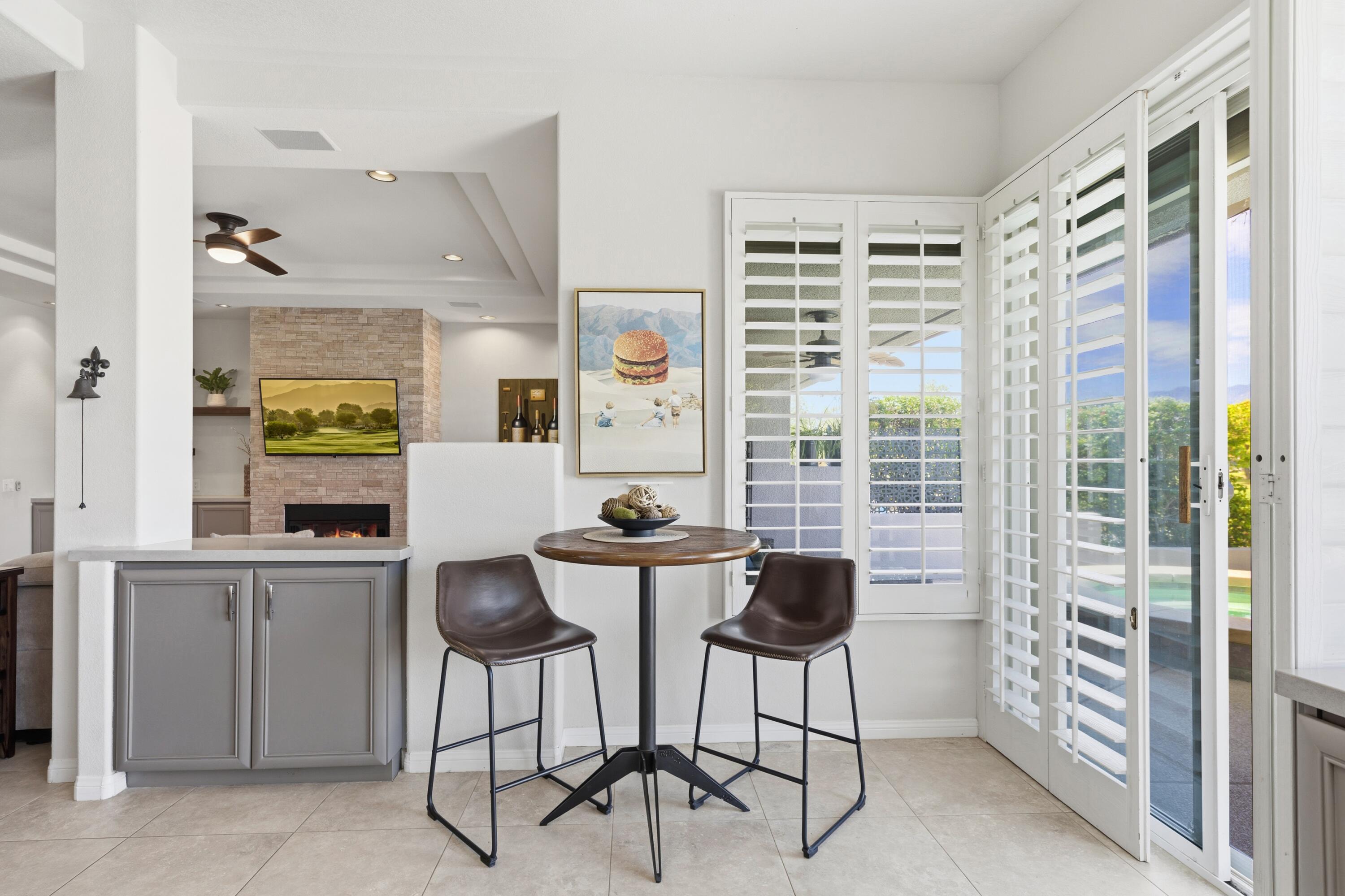 39 Augusta Drive Rancho Mirage, CA 92270 - Photo 20 of 53 a dining room with furniture and a window