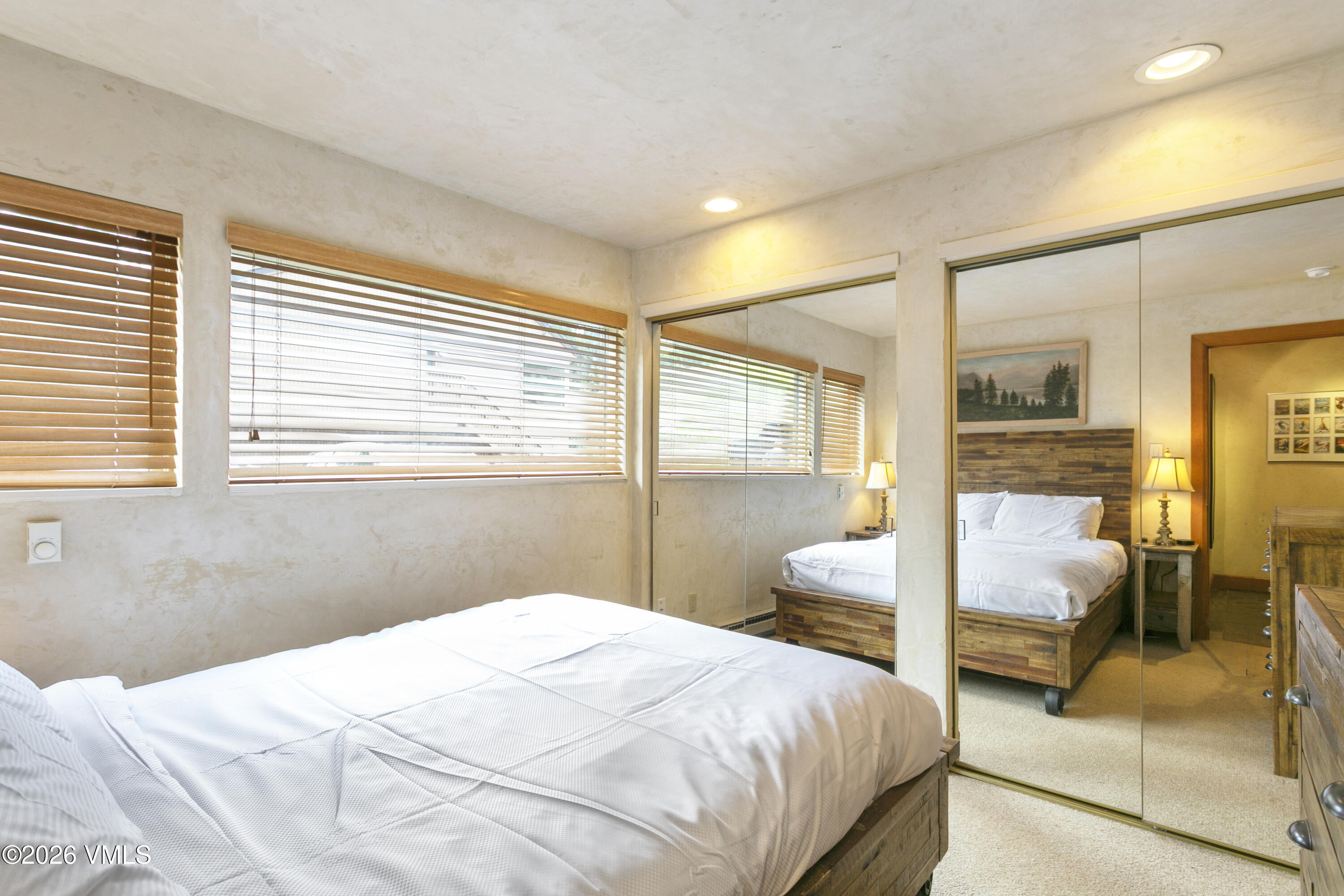 3911 Big Horn Road, Unit 1B Vail, CO 81657 - Photo 14 of 29 a bedroom with a bed and wooden floor