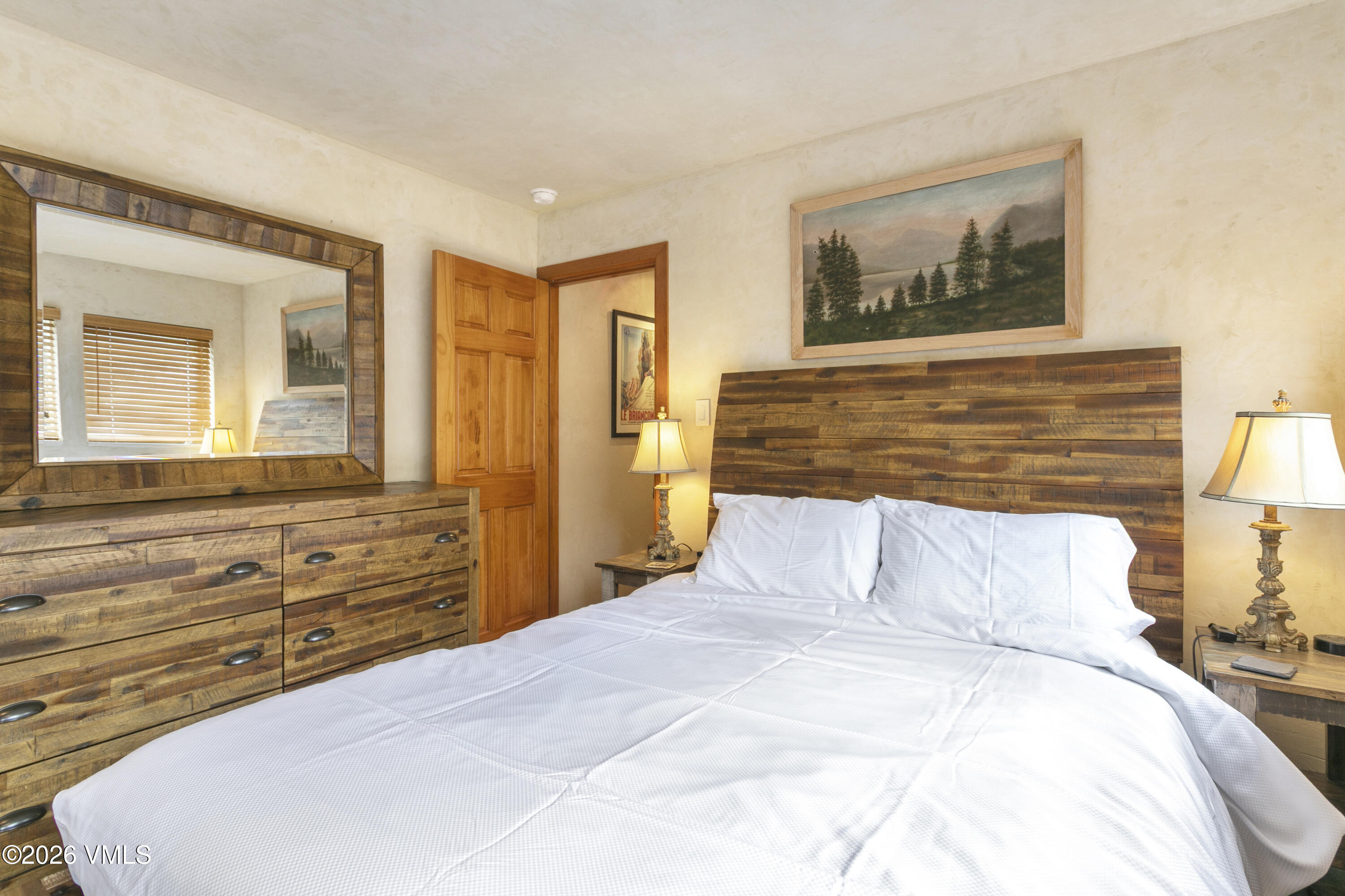 3911 Big Horn Road, Unit 1B Vail, CO 81657 - Photo 15 of 29 a bedroom with a bed and a dresser