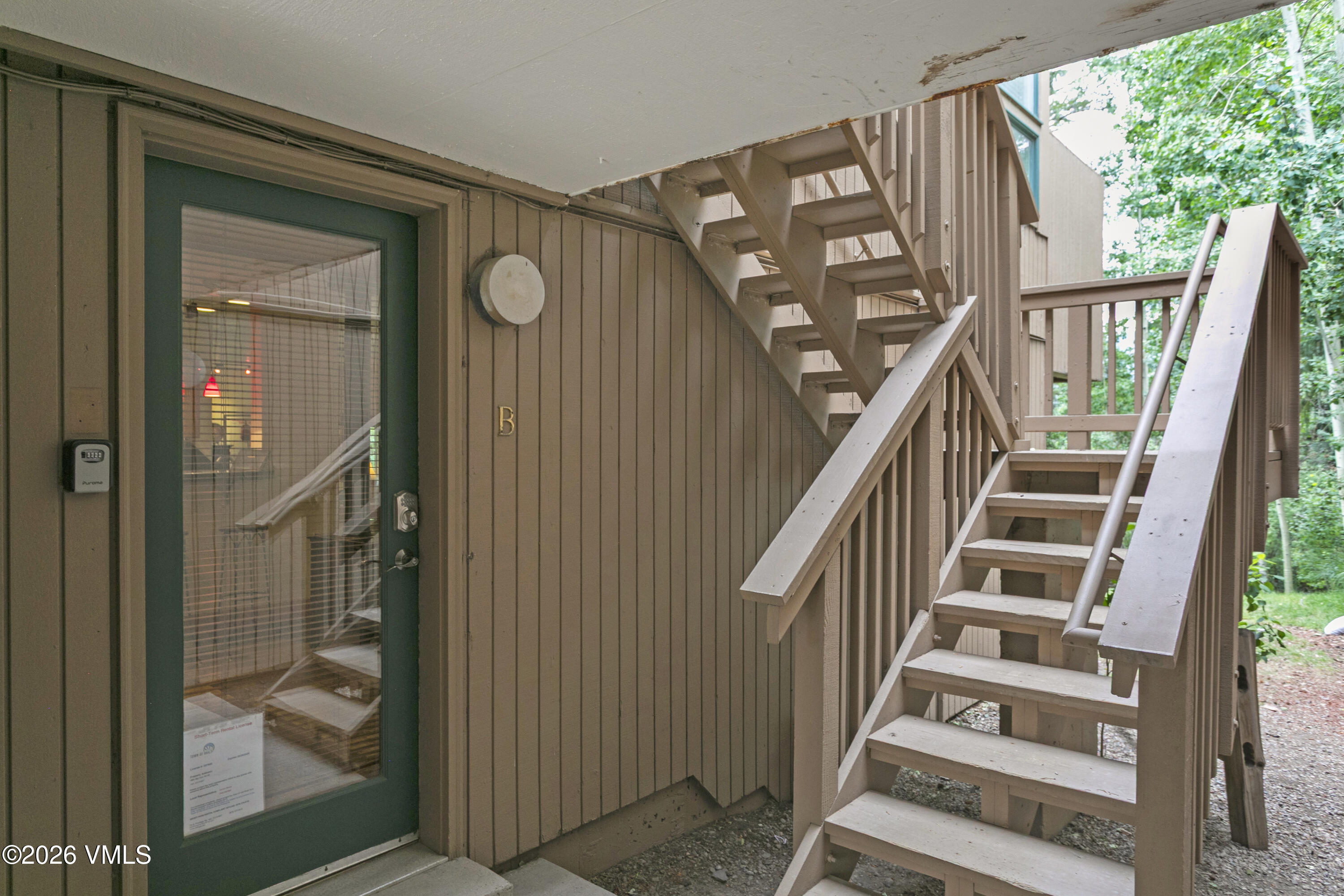 3911 Big Horn Road, Unit 1B Vail, CO 81657 - Photo 17 of 29 a view of staircase with wooden floor and windows