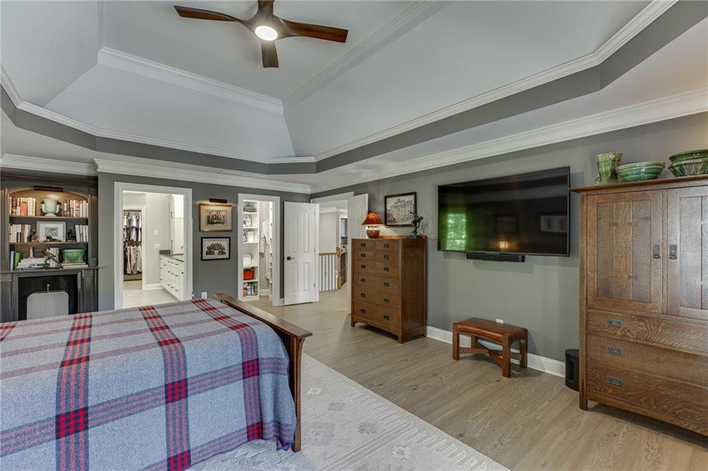 2758 Pathview Drive Dacula, GA 30019 - Photo 31 of 48 a bedroom with a bed a mirror and dresser