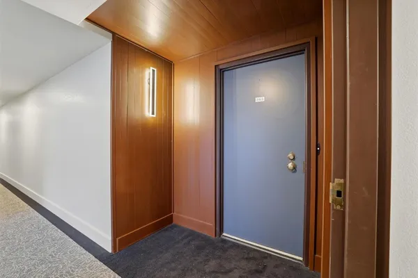 a view of a hallway with closet area