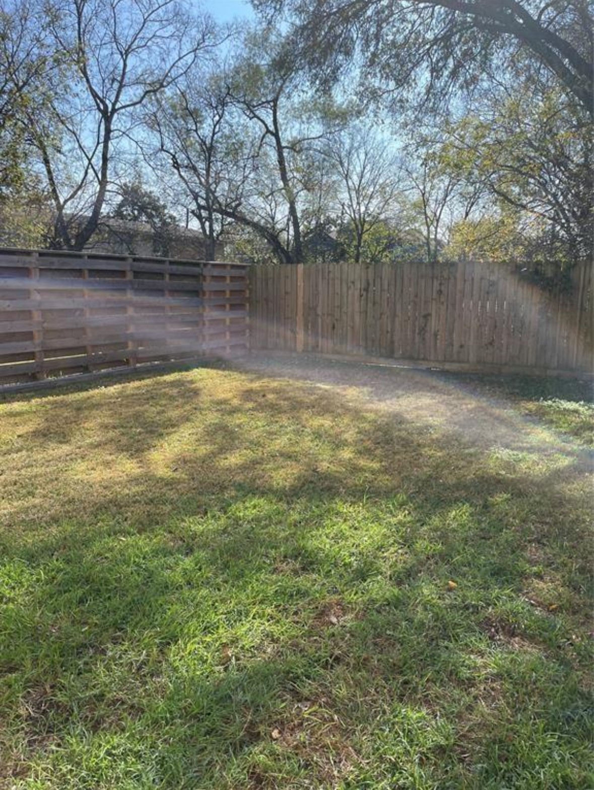 5204 Hershe Street, Unit B Houston, TX 77020 - Photo 11 of 11 a view of a yard with wooden fence