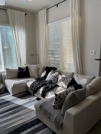 a living room with furniture and window