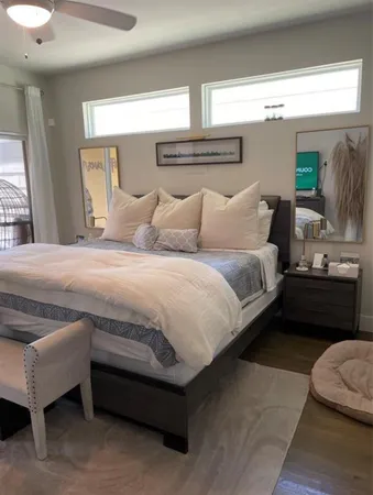 a bedroom with a bed and a couch