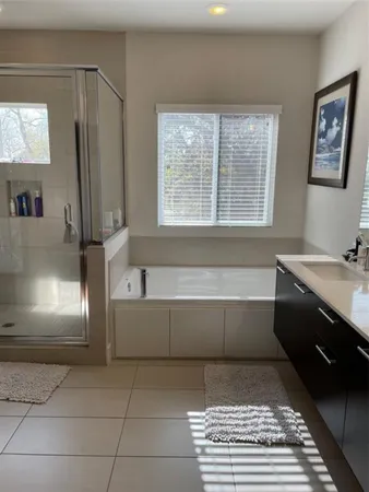 a bathroom with a bathtub and a sink