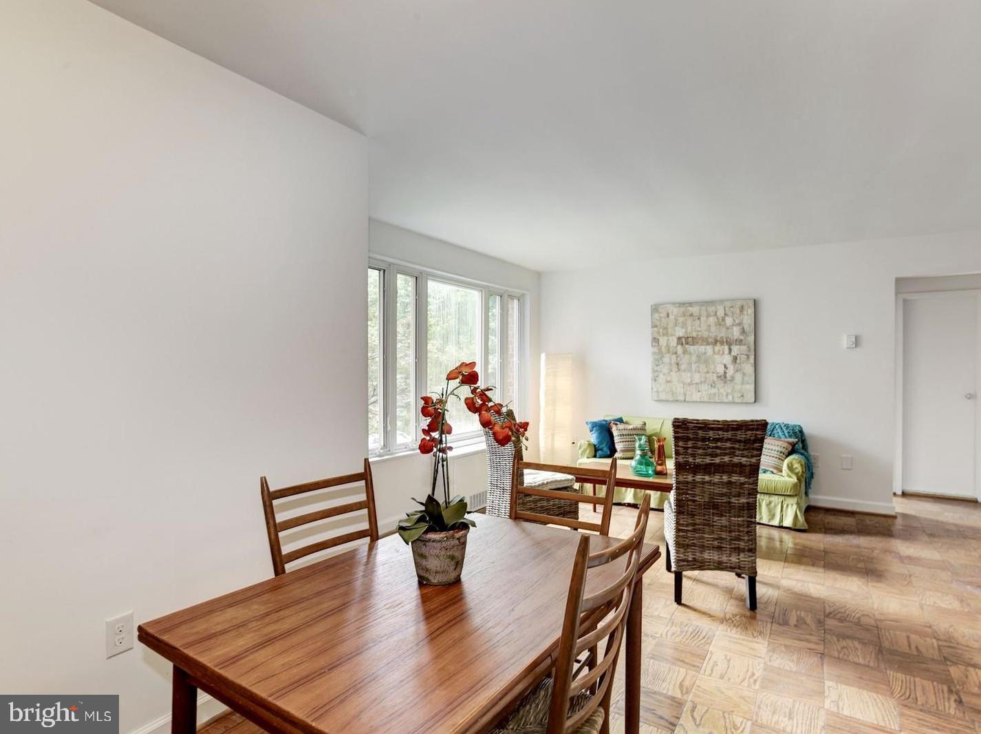 2400 41st Street Northwest, Unit 203 Washington, DC 20007 - Photo 3 of 24 a view of a dining room with furniture