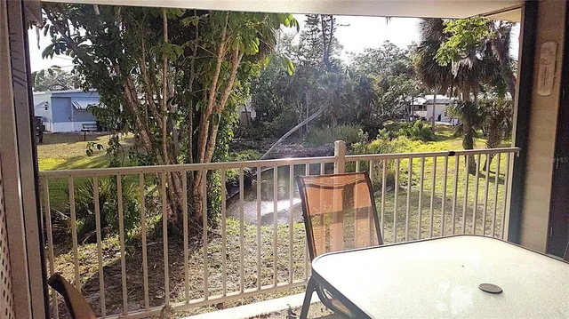 a view of balcony with furniture