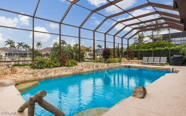 a view of a swimming pool with a patio