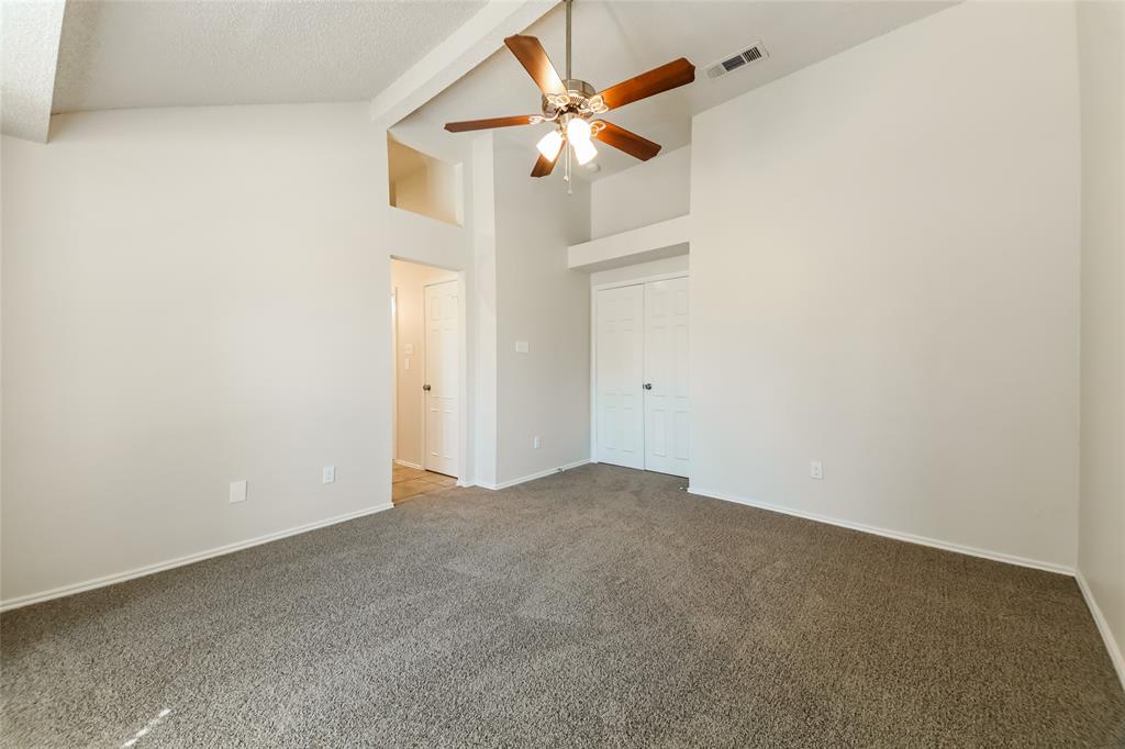 3511 Jasmine Lane Rowlett, TX 75089 - Photo 17 of 27 an empty room with a ceiling fan and a window