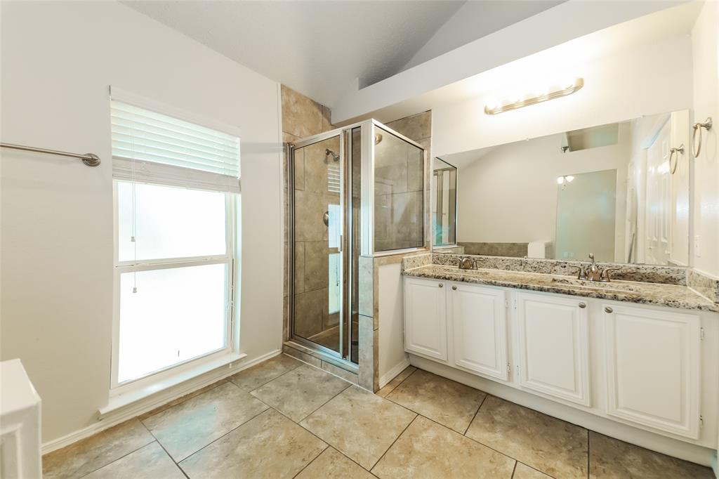 3511 Jasmine Lane Rowlett, TX 75089 - Photo 18 of 27 a bathroom with a granite countertop sink and a mirror