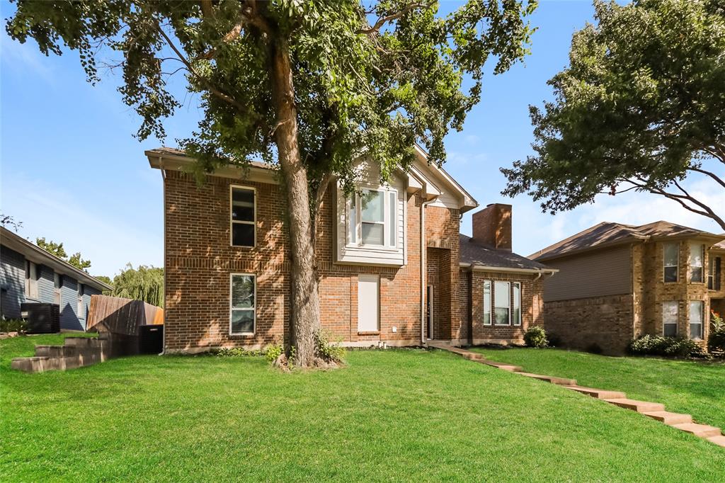 3511 Jasmine Lane Rowlett, TX 75089 - Photo 4 of 27 a front view of a house with a garden