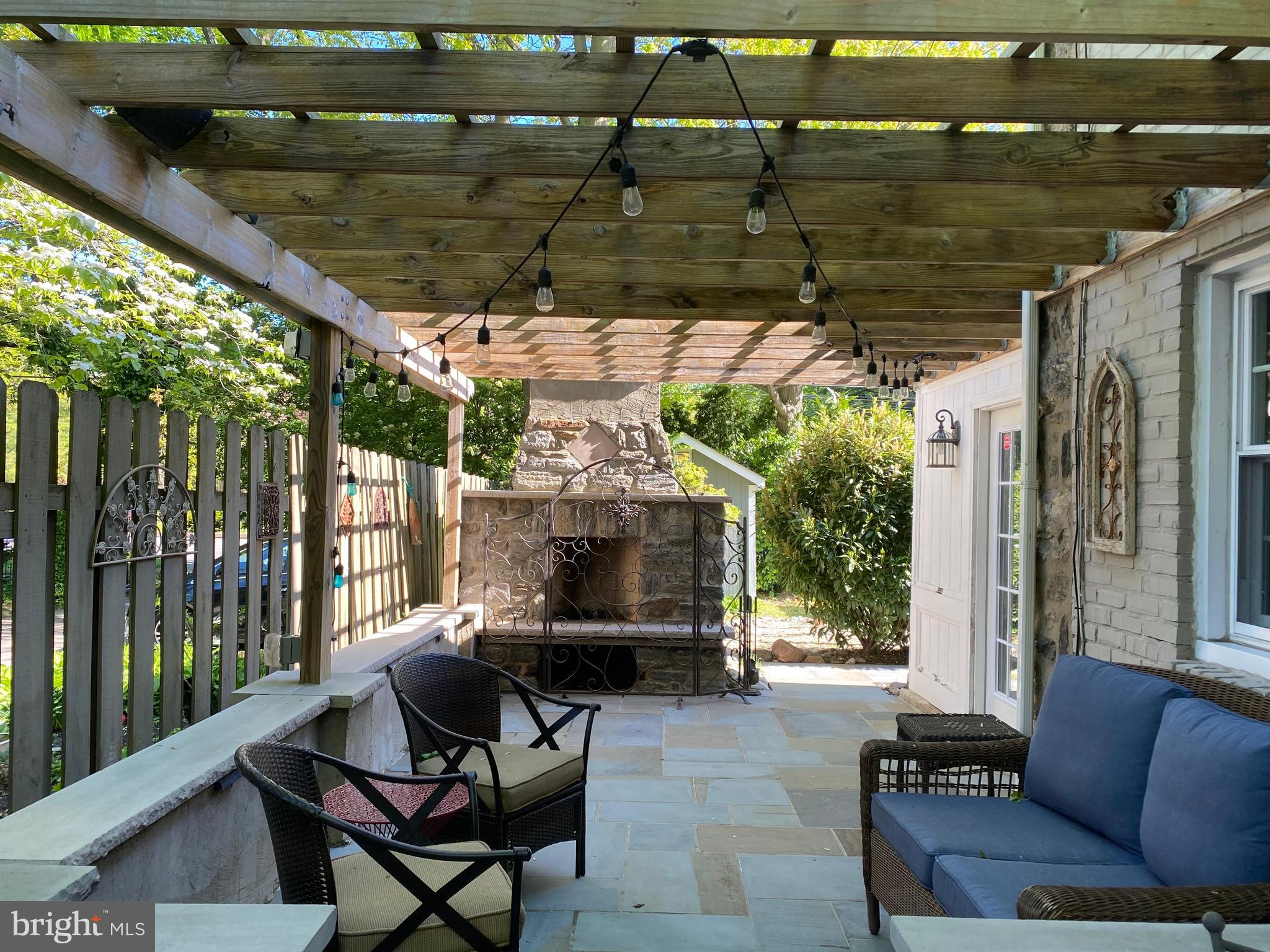 1201 Knox Road Wynnewood, PA 19096 - Photo 11 of 49 a backyard of a house with outdoor seating