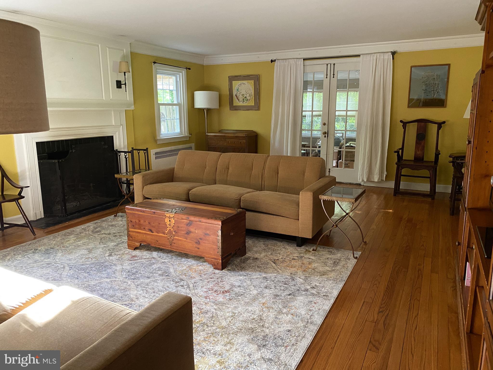 1201 Knox Road Wynnewood, PA 19096 - Photo 23 of 49 a living room with furniture and a fireplace