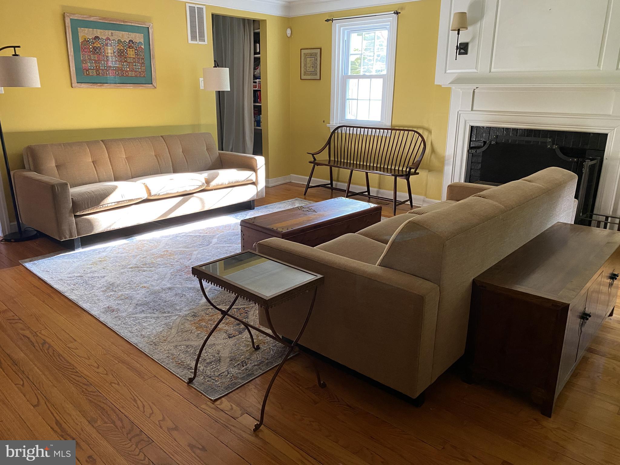 1201 Knox Road Wynnewood, PA 19096 - Photo 24 of 49 a living room with furniture and a fireplace