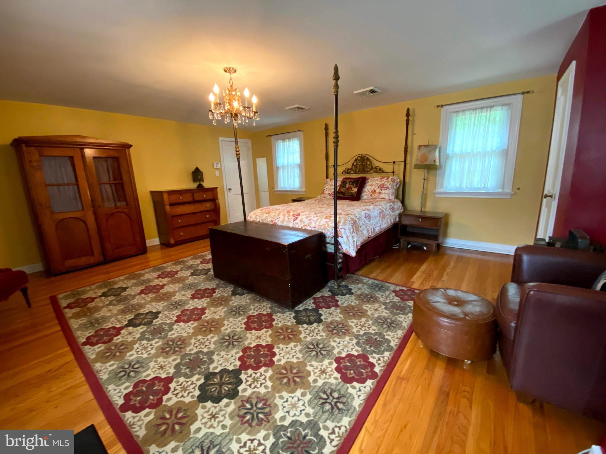 1201 Knox Road Wynnewood, PA 19096 - Photo 26 of 49 a living room with furniture and a chandelier