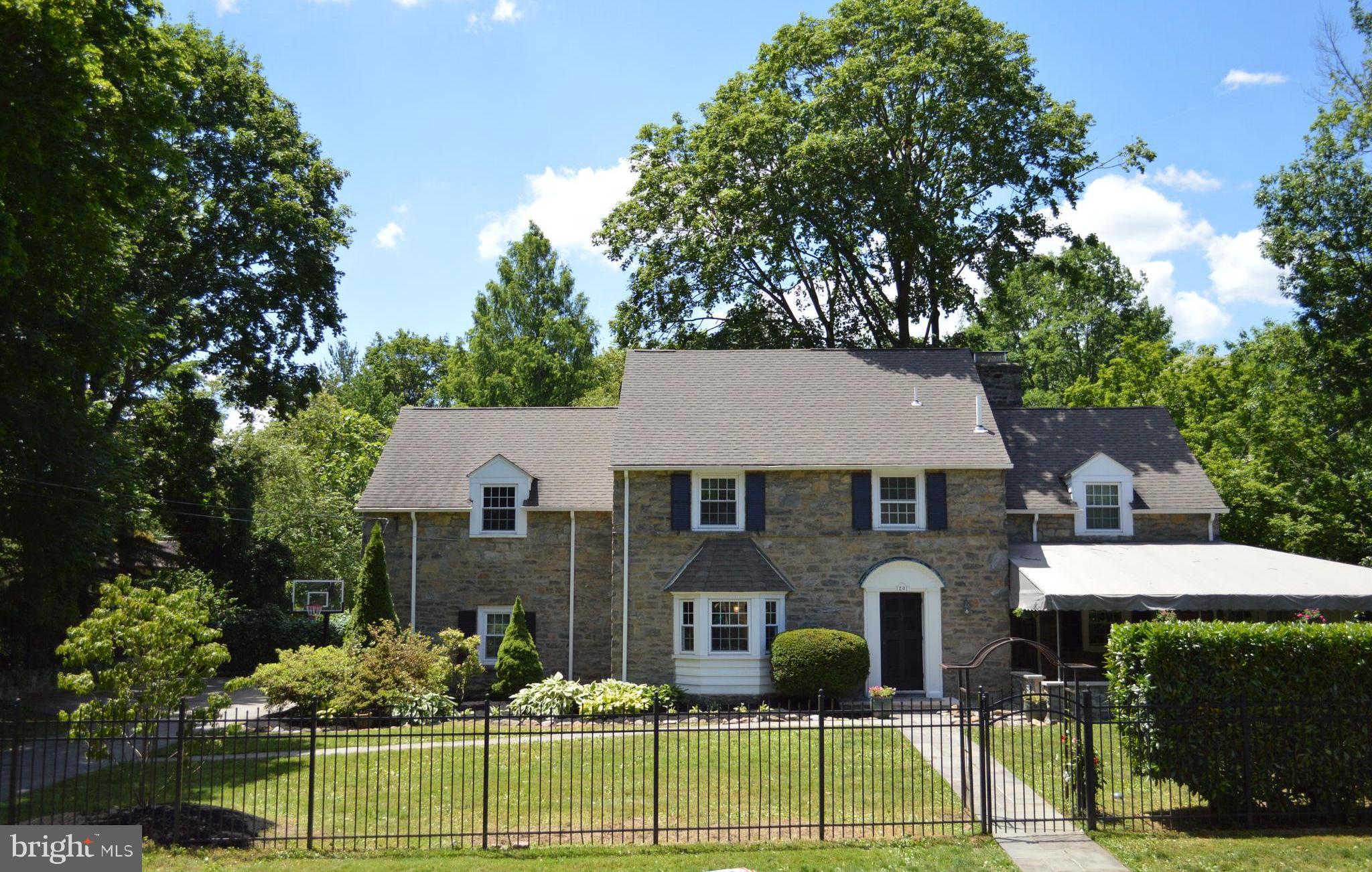 1201 Knox Road Wynnewood, PA 19096 - Photo 4 of 49 a front view of a house with garden