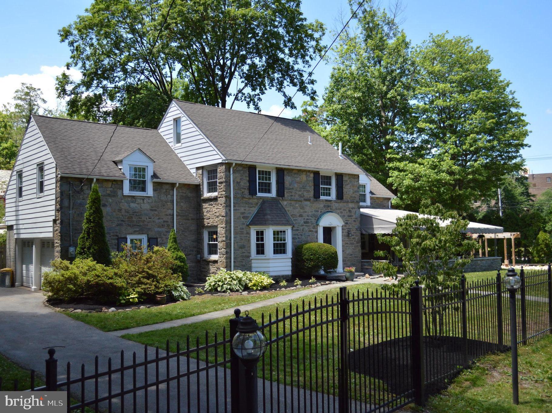 1201 Knox Road Wynnewood, PA 19096 - Photo 6 of 49 a front view of house with yard and green space