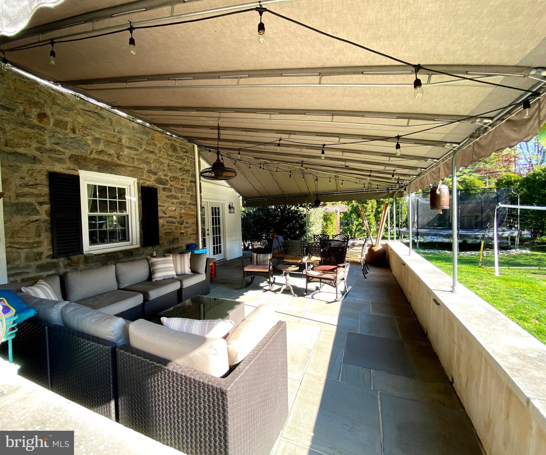1201 Knox Road Wynnewood, PA 19096 - Photo 10 of 49 a view of swimming pool with outdoor seating