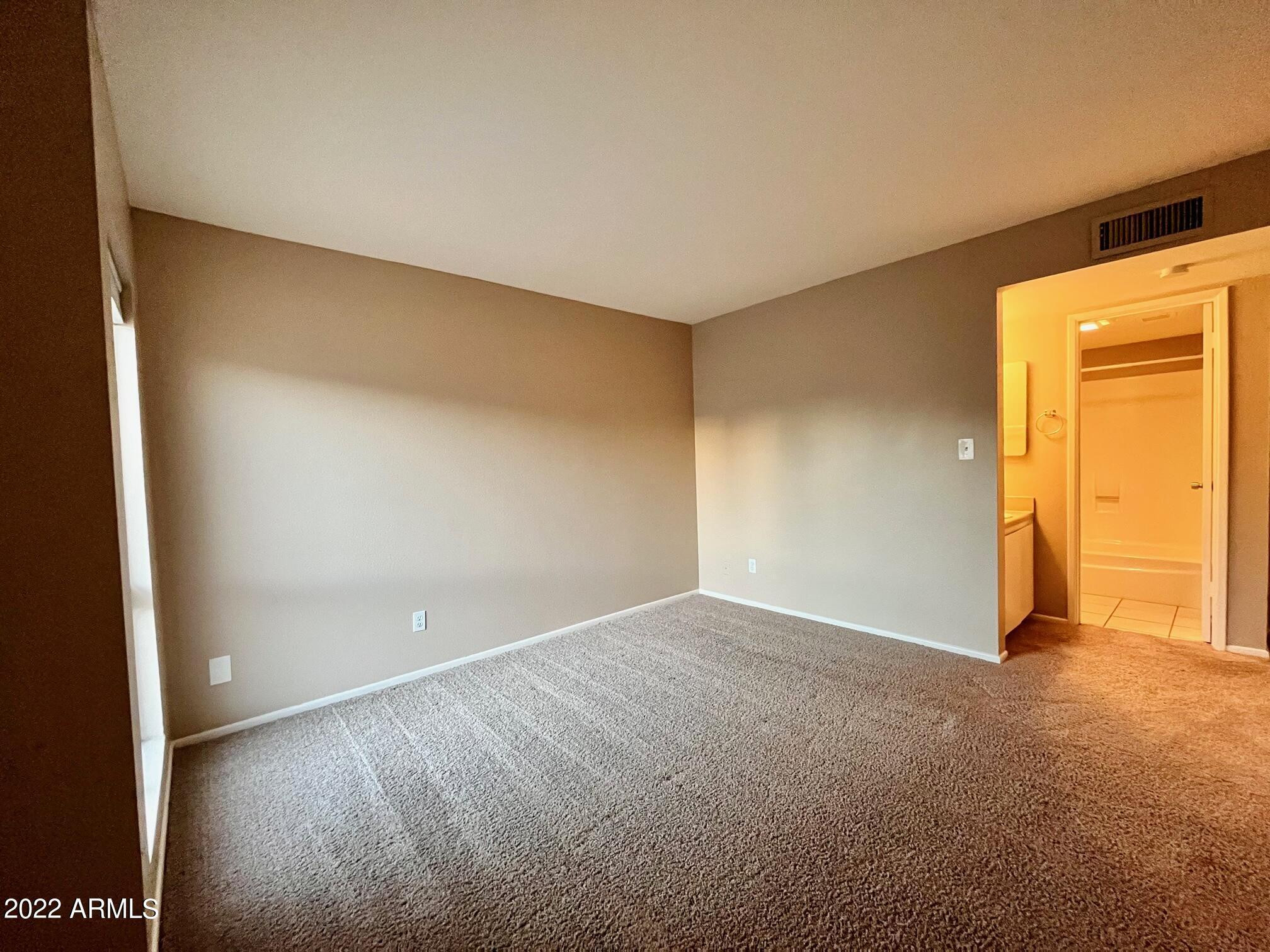 1701 West Tuckey Lane, Unit 225 Phoenix, AZ 85015 - Photo 7 of 13 a view of an empty room