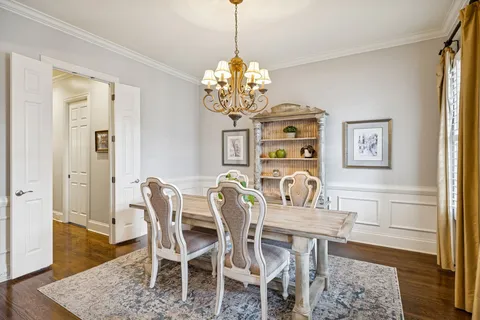 a bathroom with a tub a sink and a window