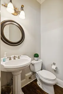 a spacious bedroom with a bed a couch and a window